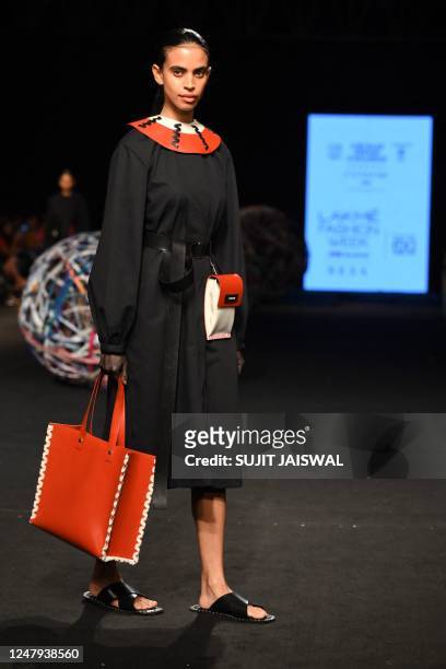 Model presents a creation by Chamar during the Lakmé Fashion Week x FDCI, in Mumbai on March 9, 2023. / -- IMAGE RESTRICTED TO EDITORIAL USE -...