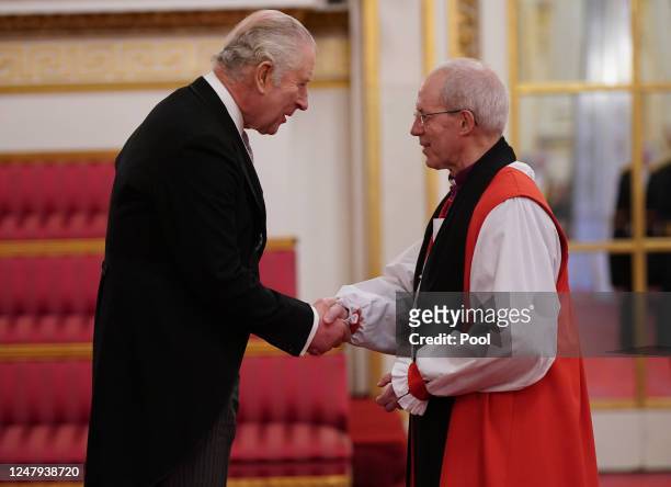 King Charles III shakes hands with Archbishop of Canterbury, Justin Welby, during a presentation of loyal addresses by the privileged bodies, at a...