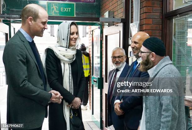 Britain's Prince William, Prince of Wales and Britain's Catherine, Princess of Wales are welcomed by Iman Sufyan Iqbal upond their arrival at the...