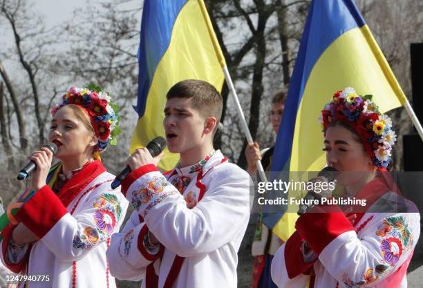 Singers in folk costumes perform at the monument to Taras Shevchenko on Monastyrskyi Island in celebration of 209 years since the birth of the famous...