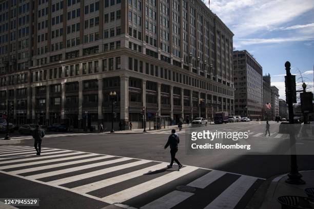 Pedestrians in Washington, DC, US, on Friday, Feb. 24, 2023. The capital citys main business district remains strangely desolate and depopulated long...