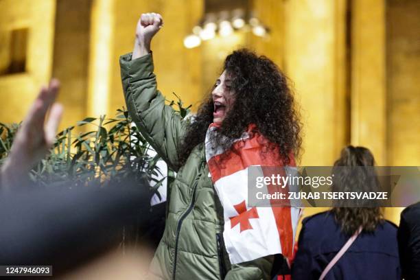 Georgian opposition supporters rally calling for government to follow 'pro-Western' path, outside the parliament in Tbilisi on March 9, 2023. -...