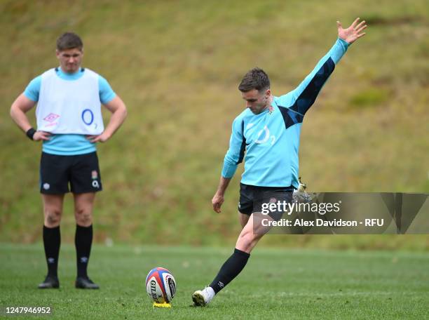 George Ford of England kicks watched on by Owen Farrell during a England Training Session at Pennyhill Park on March 06, 2023 in Bagshot, England.