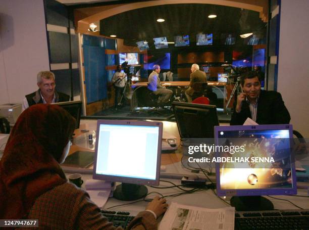 Journalists work at Al-Jazeera's channel regional bureau in Rabat, 27 November 2006. The Qatar based television channel Al-Jazeera broadcasted 17...