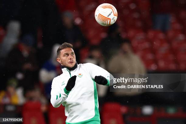 Real Betis' Spanish midfielder Joaquin warms up ahead of the UEFA Europa league round of 16 first leg football match between Manchester United and...