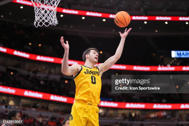 Ohio State Buckeyes guard Tanner Holden grabs the rebound during the first half of the second round of the Big Ten Conference Men's Basketball...