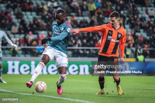 Lutsharel Geertruida of Feyenoord competes with Dmytro Kryskiv of Shakhtar Donetsk during the UEFA Europa League round of 16 leg one match between...