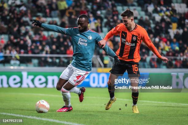 Lutsharel Geertruida of Feyenoord competes with Dmytro Kryskiv of Shakhtar Donetsk during the UEFA Europa League round of 16 leg one match between...