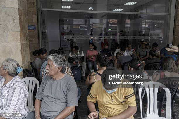 Residents wait in line outside of the state-controlled Banco Union branch in Santa Cruz de la Sierra, Bolivia, on Thursday, March 9, 2023....