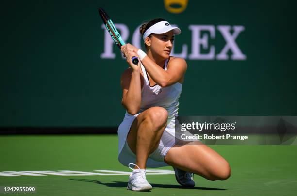 Danka Kovinic of Montenegro in action against Emma Raducanu of Great Britain during her first-round match on Day 4 of the 2023 BNP Paribas Open at...