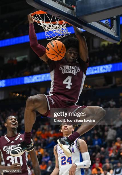 Mississippi State Bulldogs guard Cameron Matthews dunks the ball during an SEC Mens Basketball Tournament game between the Mississippi State Bulldogs...