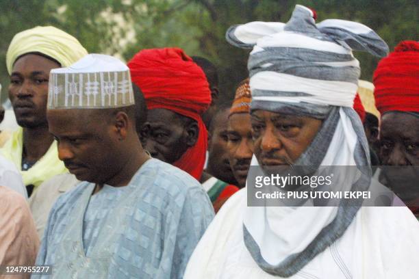 Emir of Kano Ado Bayero and Kano state governor Rabiu Kwankwaso gather and mourn at Kano city palace, northern Nigeria, 06 May 2002, before a mass...