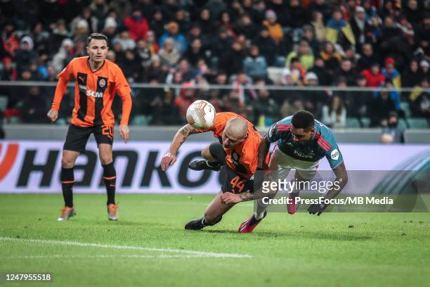 Yaroslav Rakitsky of Shakhtar Donetsk competes with Danilo of Feyenoord during the UEFA Europa League round of 16 leg one match between Shakhtar...
