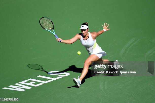 Danka Kovinic of Montenegro hits a forehand return against Emma Raducanu of Great Britain against during her first-round match of the 2023 BNP...