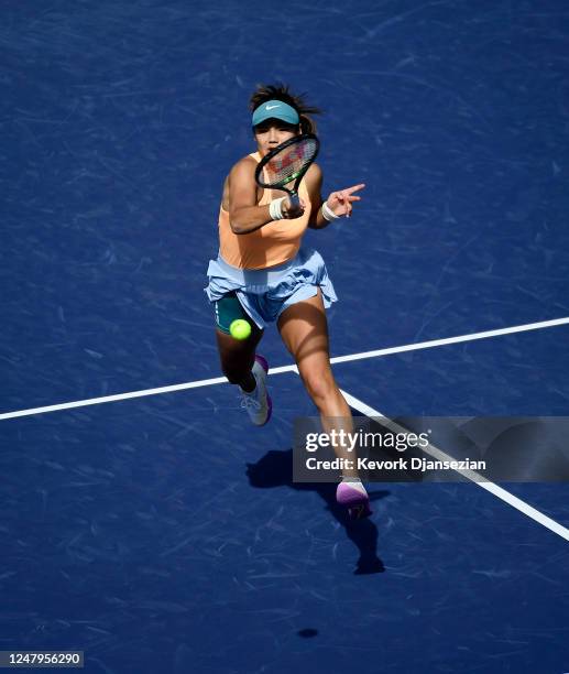 Emma Raducanu of Great Britain hits a forehand return gainst Danka Kovinic of Montenegro during her first-round match of the 2023 BNP Paribas Open at...