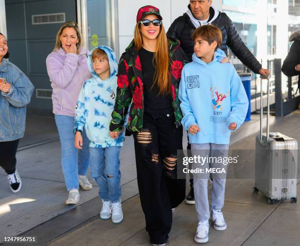 Sasha Pique Mebarak, Shakira and Milan Pique Mebarak are seen at JFK Airport on March 9, 2023 in New York City.