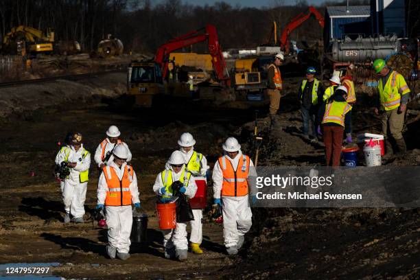 Ohio EPA and EPA contractors collect soil and air samples from the derailment site on March 9, 2023 in East Palestine, Ohio. Cleanup efforts continue...