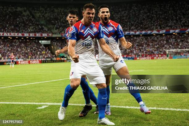 Cerro Porteño's Argentine forward Diego Churin celebrates after scoring against Fortaleza during the Copa Libertadores third round first leg football...