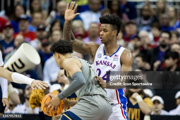 Kansas forward K.J. Adams Jr. Defense against a West Virginia opponent during the Big12 Tournament game between the Kansas Jayhawks and the West...