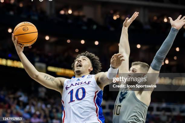Kansas forward Jalen Wilson shoots the ball for a contested jumper during the Big12 Tournament game between the Kansas Jayhawks and the West Virginia...