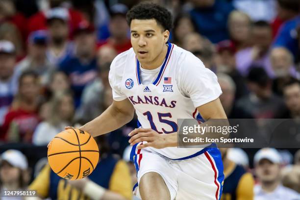 Kansas guard Kevin McCullar Jr. Brings the ball up court during the Big12 Tournament game between the Kansas Jayhawks and the West Virginia...