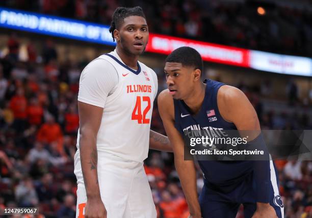 Illinois Fighting Illini forward Dain Dainja and Penn State Nittany Lions forward Kebba Njie wait for play to begin during the first half of the...