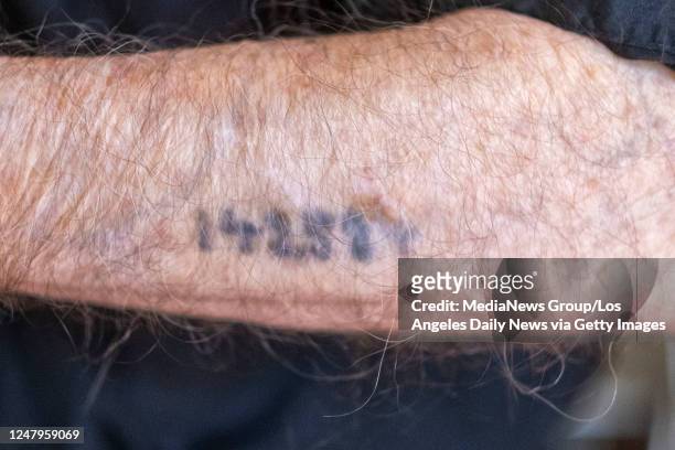Los Angeles, CA Holocaust Survivor Joseph Alexander shows the number tattoo he received when he arrived at the Auschwitz concentration camp....