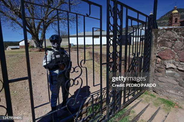 National Guard officer guards the San Francisco Javier Parish, in Cerocahui, in the Tarahumara mountains of the state of Chihuahua, Mexico, on March...