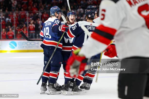 Trevor van Riemsdyk, Craig Smith, Rasmus Sandin and Nicklas Backstrom of the Washington Capitals celebrate a goal against the New Jersey Devils at...