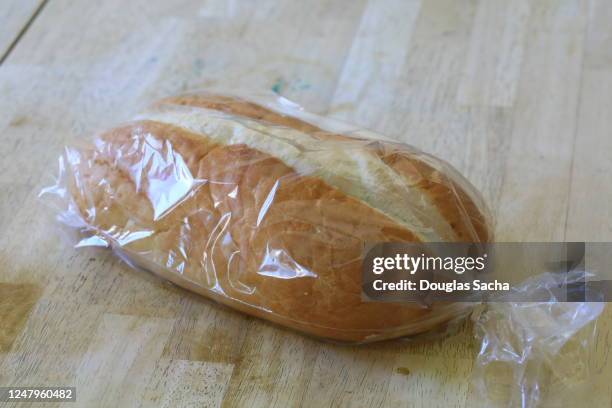 loaf of bread in a clear plastic bag - bread packet stock pictures, royalty-free photos & images