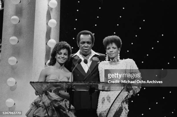 American singer Lou Rawls with singers Rebbie Jackson and Melba Moore at the 1985 Black Gold Awards at the Cocoanut Grove, Ambassador Hotel, Los...