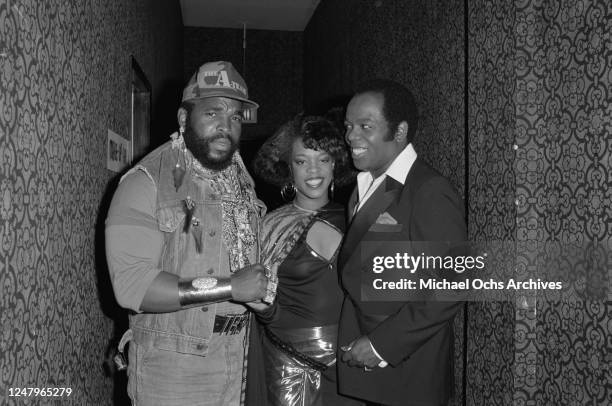 From left to right, American actor Mr T with singers Evelyn 'Champagne' King and Lou Rawls during the 1985 Black Gold Awards in Los Angeles, 1985. Mr...