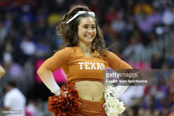 Texas Longhorns cheerleader in the second half of a Big 12 Tournament quarterfinal basketball game between the Oklahoma State Cowboys and Texas...