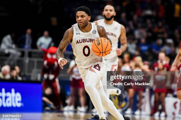 Johnson of the Auburn Tigers drives to the basket against the Arkansas Razorbacks during the second half of the second round of the 2023 SEC Men's...