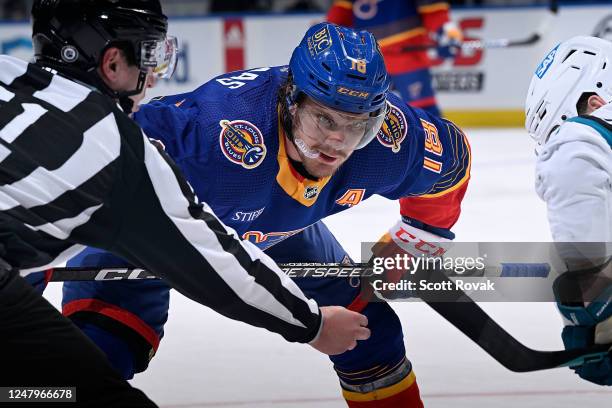 Robert Thomas of the St. Louis Blues prepares to face off against the San Jose Sharks at the Enterprise Center on March 9, 2023 in St. Louis,...