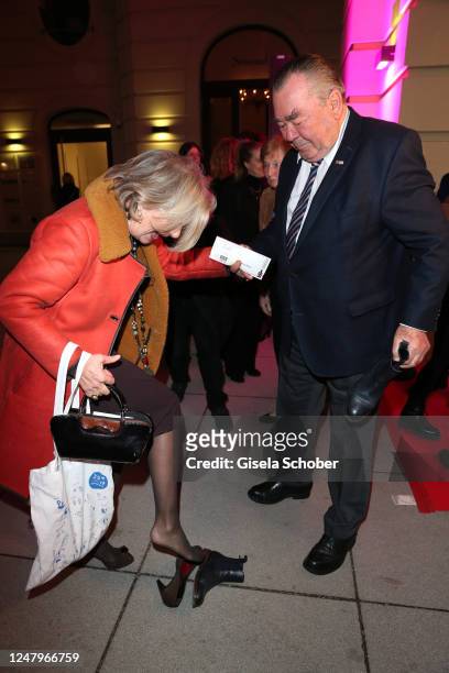 Jutta Speidel and Heinrich Traublinger put of her shoes during the "Dirty Dancing" musical premiere at Deutsches Theater on March 9, 2023 in Munich,...