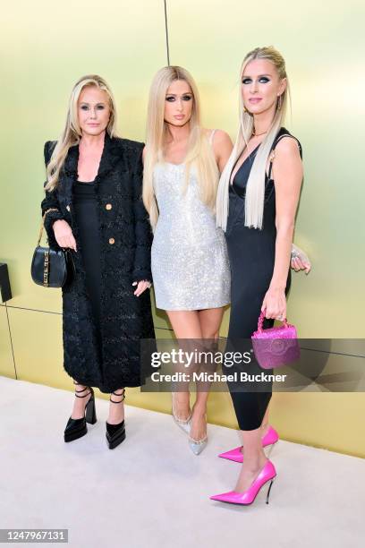 Kathy Hilton, Paris Hilton and Nicky Hilton Rothschild at the Versace Fall-Winter 2023 Fashion Show held at Pacific Design Center on March 9, 2023 in...