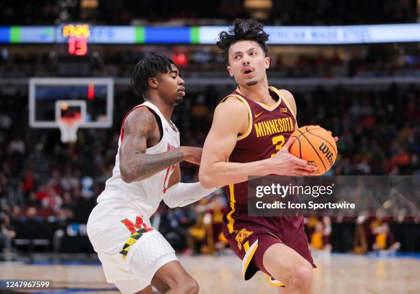 Maryland Terrapins guard Hakim Hart posts up against Minnesota Golden Gophers forward Dawson Garcia during the first half of the second round of the...