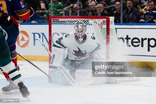 San Jose Sharks goaltender Kaapo Kahkonen looks for the puck during the third period of an NHL hockey game between the St. Louis Blues and the San...