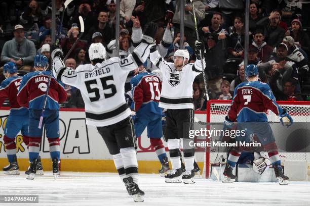 Quinton Byfield and Adrian Kempe of the Los Angeles Kings celebrate a goal against the Colorado Avalanche at Ball Arena on March 9, 2023 in Denver,...