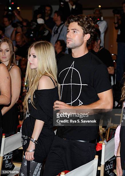 Singer Avril Lavigne and American television personality Brody Jenner attend the Abbey Dawn by Avril Lavigne Spring 2012 fashion show during Style360...