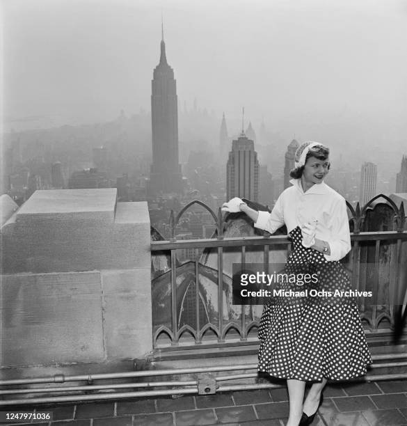 Fashion shoot for the clothing brand Fruit Of The Loom on top of 30 Rockefeller Plaza in New York City, 27th March 1952. The Empire State Building is...