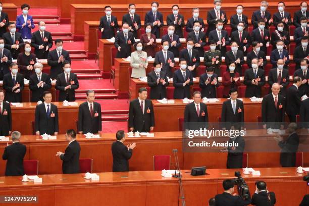 Chinese President Xi Jinping (C and Communist Party members attend the 1st General Assembly of the ongoing 14th term of the Chinese National People's...