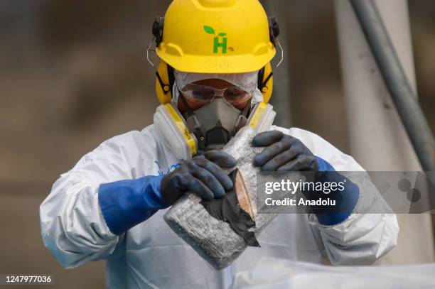 Construction workers work in a construction with the material obtained by encapsulation method, which consists of the destruction of cocaine in...