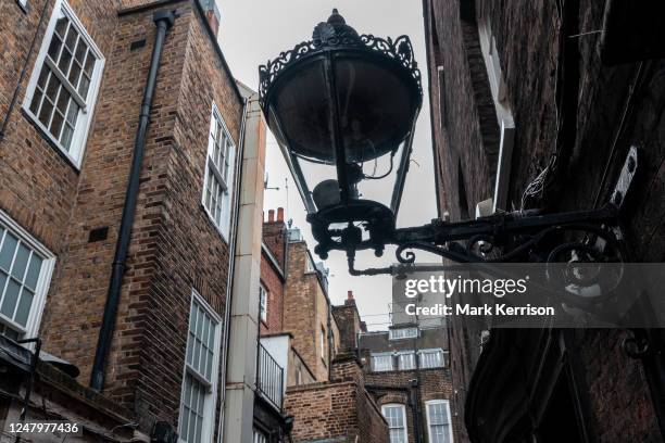 One of London's last remaining gas lamps is pictured near Covent Garden on 7 March 2023 in London, United Kingdom. Westminster City Council had...