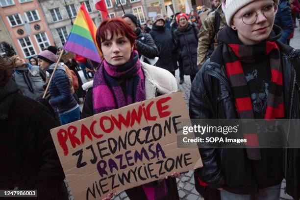 Protester holds a placard during the demonstration commemorating International Women's Day. In this year's demonstration marking International...