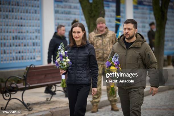 Ukrainian President Volodymyr Zelenskyy and Finnish Prime Minister Sanna Marin attend the funeral of Ukrainian soldier Dmytro Kotsiubaylo, who was...