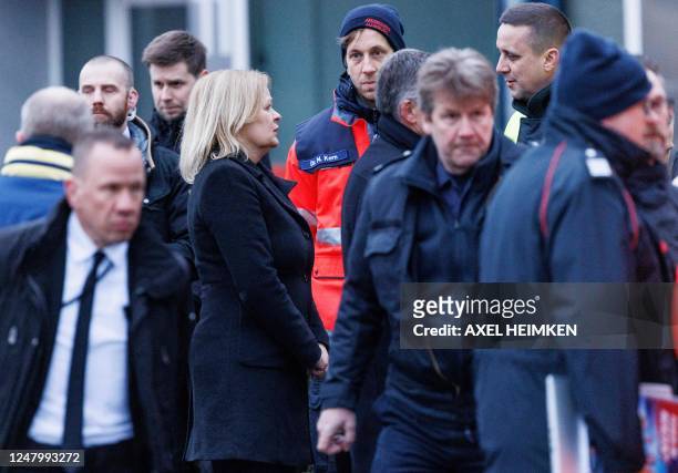 German Interior Minister Nancy Faeser speaks to first responders during a visit with Hamburg's Interior Senator at the tatort where several people...