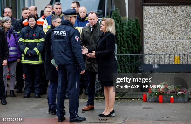 German Interior Minister Nancy Faeser speaks to a police superintendent during a visit with Hamburg's Interior Senator Andy Grote at the tatort where...