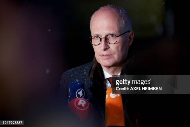 Hamburgs First Mayor Peter Tschentscher speaks to the media during a visit at the tatort where several people were killed in a church in a shooting...